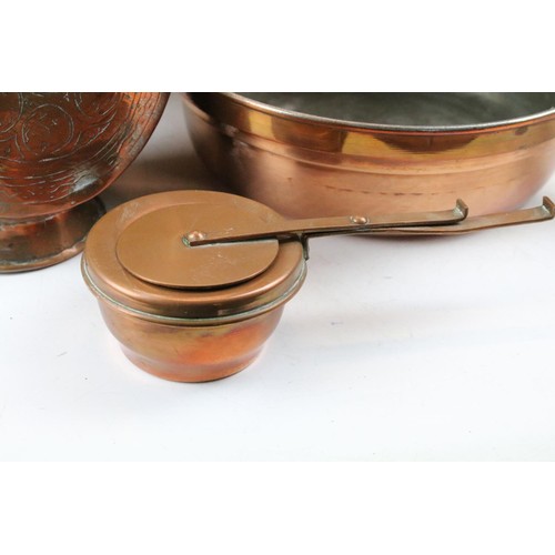 464 - Collection of assorted copper wares to include a Persian copper ewer, twon handled pot with repousse... 