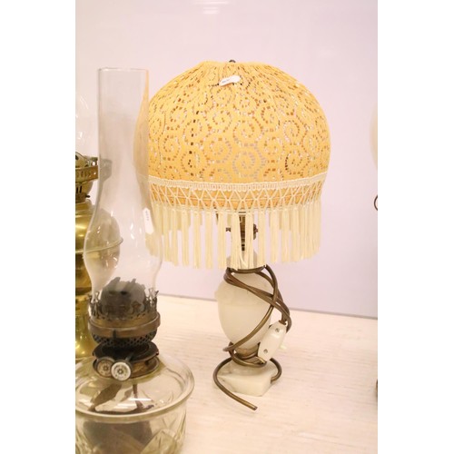 469 - Two 19th Century Victorian oil lamps having milk glass shades together with a carved stone lamp base... 