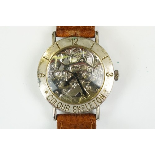 331 - A collection of four watches to include Timex, a Chairman Mau commemorative watch and a watch marked... 