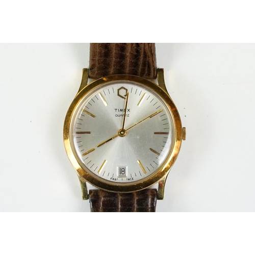 331 - A collection of four watches to include Timex, a Chairman Mau commemorative watch and a watch marked... 