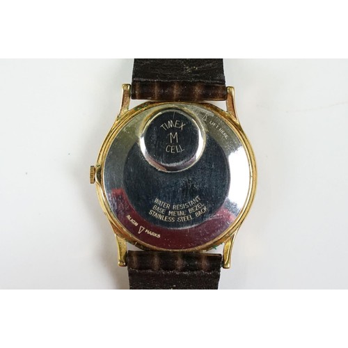 331 - A collection of four watches to include Timex, a Chairman Mau commemorative watch and a watch marked... 