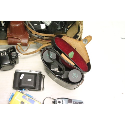 503 - A large collection of cameras contained within two boxes to include Nikon, Fujica and Canon examples... 