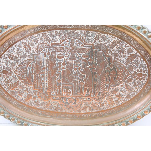 507 - A large copper / silver plated charger with repoussé decoration decoration.