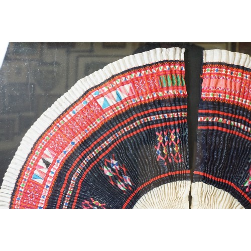 517 - Thai framed hand made tradition Hmong pleated skirt set within a ebonised wooden frame. Measures 127... 