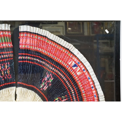 517 - Thai framed hand made tradition Hmong pleated skirt set within a ebonised wooden frame. Measures 127... 