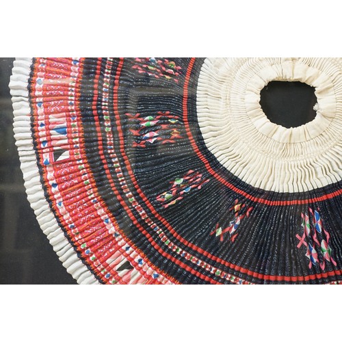 517 - Thai framed hand made tradition Hmong pleated skirt set within a ebonised wooden frame. Measures 127... 
