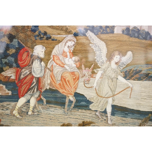 222 - Regency woolwork and silkwork panel, depicting the holy family being led from Bethlehem by the angel... 