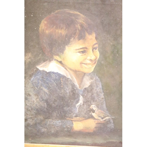 200 - Early 20th century English school, portrait of a boy with a bird, oil on canvas, 34 x 23.5cm, gilt f... 