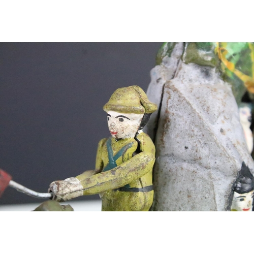 111 - Painted cast iron mechanical money box in the form of a boy scout waving his flag, approx 23cm wide