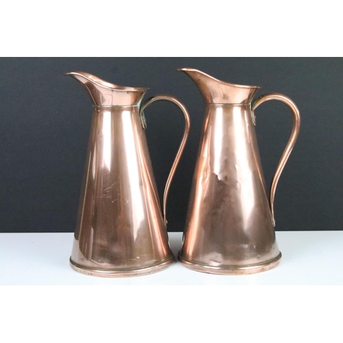 115 - Pair of Art Nouveau copper jugs by Joseph Sankey, 23cm high