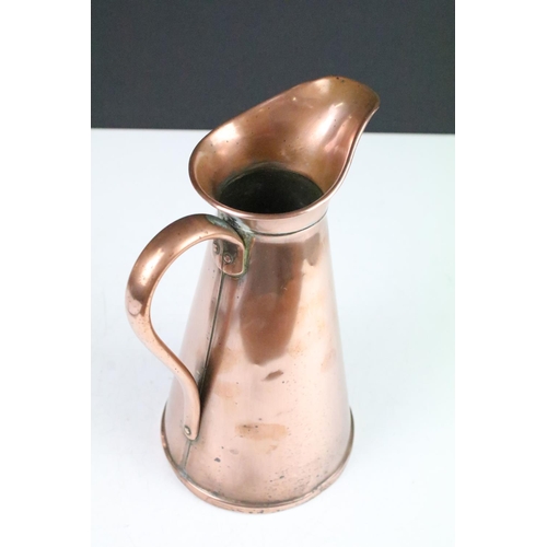 115 - Pair of Art Nouveau copper jugs by Joseph Sankey, 23cm high