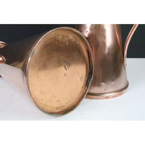 115 - Pair of Art Nouveau copper jugs by Joseph Sankey, 23cm high