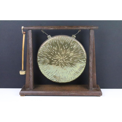 117 - Early 20th century oak and brass dinner gong complete with striker, approx 35cm tall