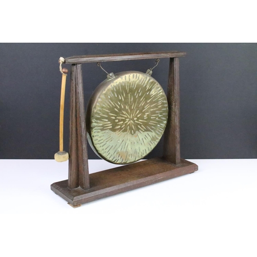 117 - Early 20th century oak and brass dinner gong complete with striker, approx 35cm tall