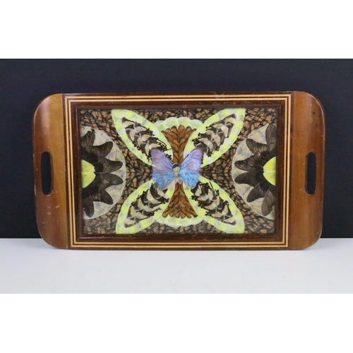 119 - Small wooden inlaid tray inset with butterfly wings, 42cm long