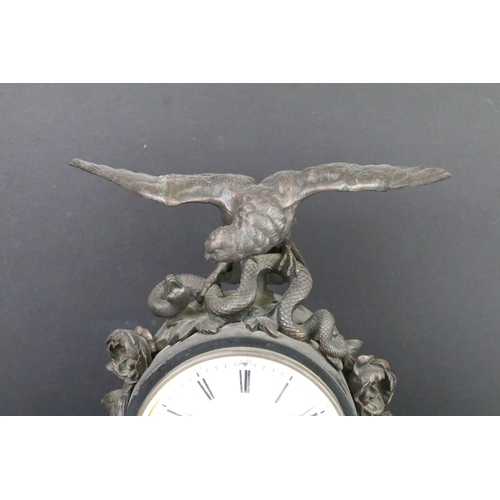 128 - Large Victorian slate mantel clock with scroll detail surmounted by an eagle and a snake, the white ... 