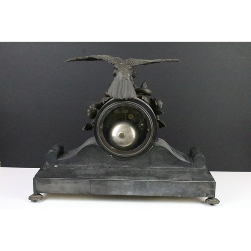 128 - Large Victorian slate mantel clock with scroll detail surmounted by an eagle and a snake, the white ... 