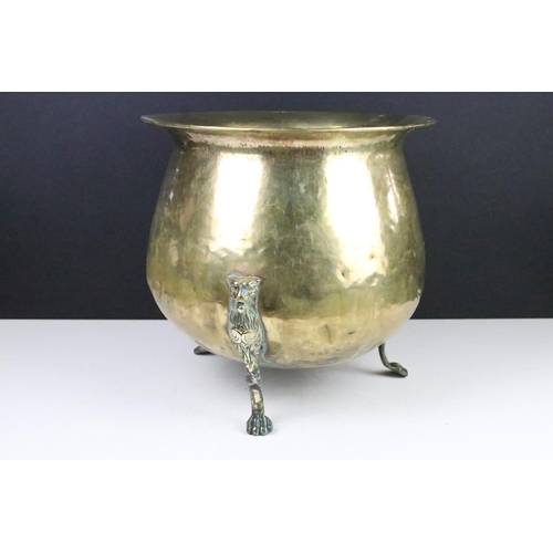 137 - Victorian brass planter raised on three cast lion supports, approx 31cm tall