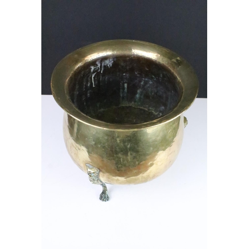 137 - Victorian brass planter raised on three cast lion supports, approx 31cm tall