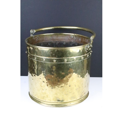 141 - Late Victorian coal bucket of cylindrical form with studded design and loop handle, approx 50cm tall... 