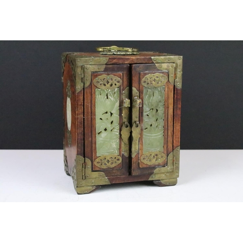 142 - Small Chinese jewellery cabinet with jade & brass decoration, the two doors opening to the drawers w... 