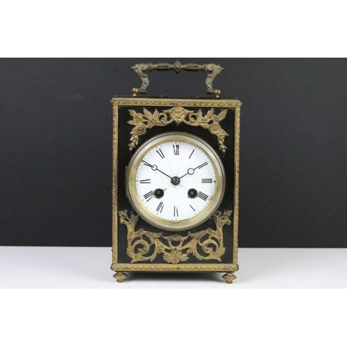 143 - Late 19th century ebonised mantel clock with scrolled ormolu mounts, the white enamel dial with blac... 