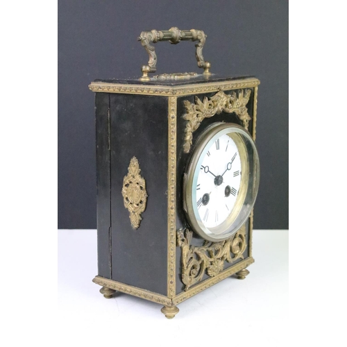 143 - Late 19th century ebonised mantel clock with scrolled ormolu mounts, the white enamel dial with blac... 