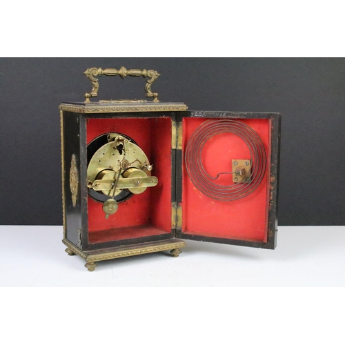 143 - Late 19th century ebonised mantel clock with scrolled ormolu mounts, the white enamel dial with blac... 