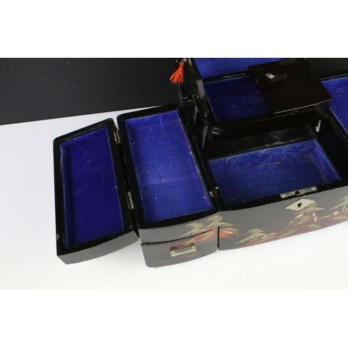 163 - Japanese black lacquered jewellery box decorated with a mountain scene, opening to various internal ... 