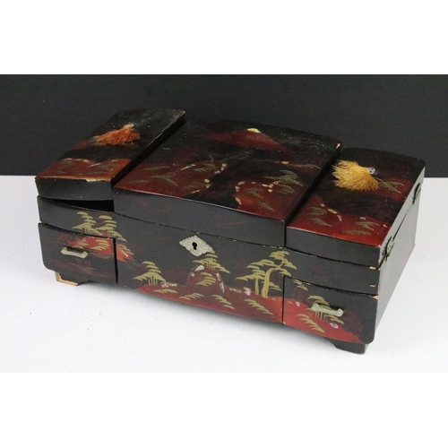 163 - Japanese black lacquered jewellery box decorated with a mountain scene, opening to various internal ... 