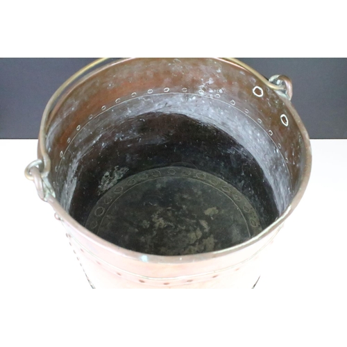 173 - Victorian copper coal bucket of cylindrical form, studded design, with brass loop handle, approx 30c... 