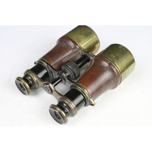 189 - Two pairs of antique binoculars to include a pair of A Tubuet Paris binoculars, a pair of unmarked e... 