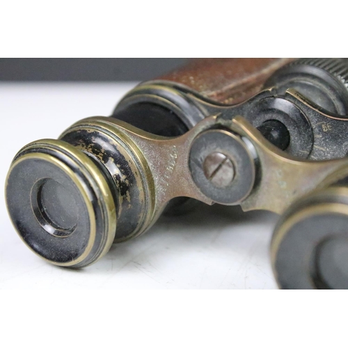 189 - Two pairs of antique binoculars to include a pair of A Tubuet Paris binoculars, a pair of unmarked e... 