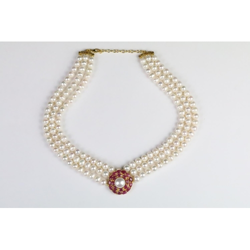 210 - Fresh water pearl three strand necklace with ruby clasp