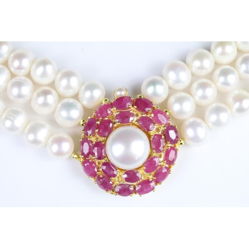 210 - Fresh water pearl three strand necklace with ruby clasp