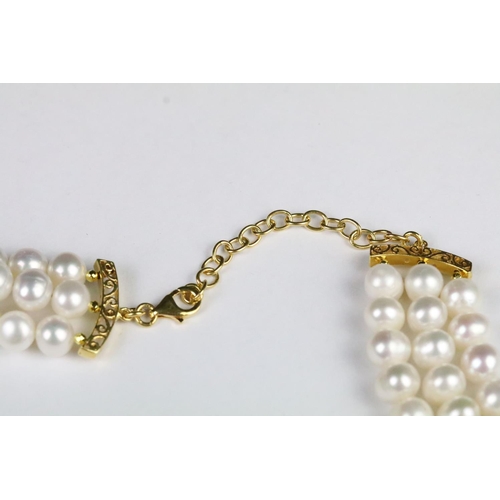 210 - Fresh water pearl three strand necklace with ruby clasp