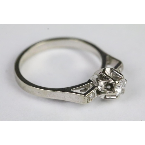 219 - 18ct white gold diamond art deco ring with a raised centre stone