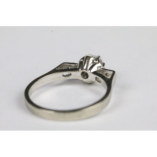 219 - 18ct white gold diamond art deco ring with a raised centre stone