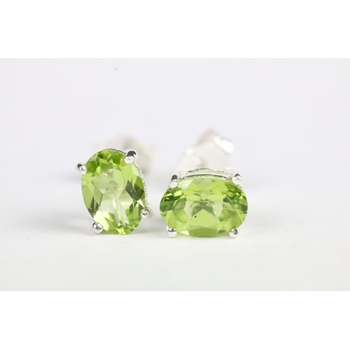 225 - Pair of peridot stud earrings set with silver posts