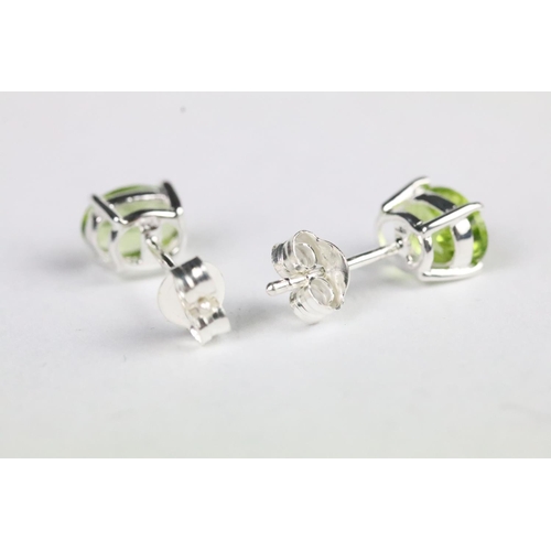 225 - Pair of peridot stud earrings set with silver posts