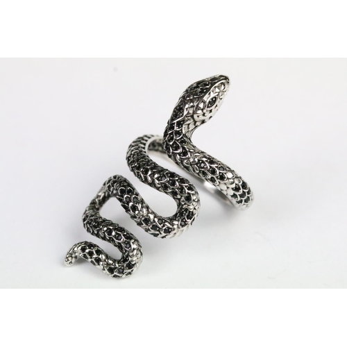 230 - Silver and black stone snake ring in the form of a coiled snake set with round cut faceted black sto... 