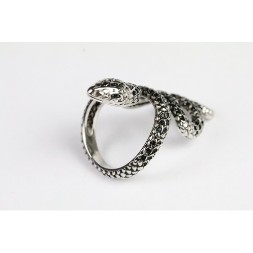 230 - Silver and black stone snake ring in the form of a coiled snake set with round cut faceted black sto... 