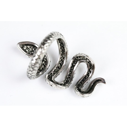 230 - Silver and black stone snake ring in the form of a coiled snake set with round cut faceted black sto... 