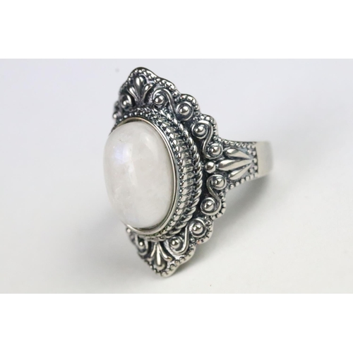 233 - Silver and moonstone dress ring set with an oval cabochon to centre. Marked 925. Size P.5.