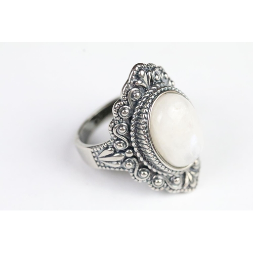 233 - Silver and moonstone dress ring set with an oval cabochon to centre. Marked 925. Size P.5.