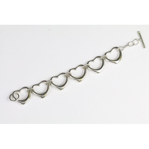 235 - Collection of silver bracelets to include a cultured pearl bracelet with toggle clasp, heart link br... 