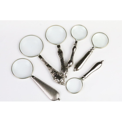 258 - Set of six graduated silver plated magnifying glasses