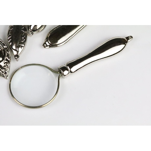 258 - Set of six graduated silver plated magnifying glasses