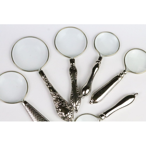 258 - Set of six graduated silver plated magnifying glasses