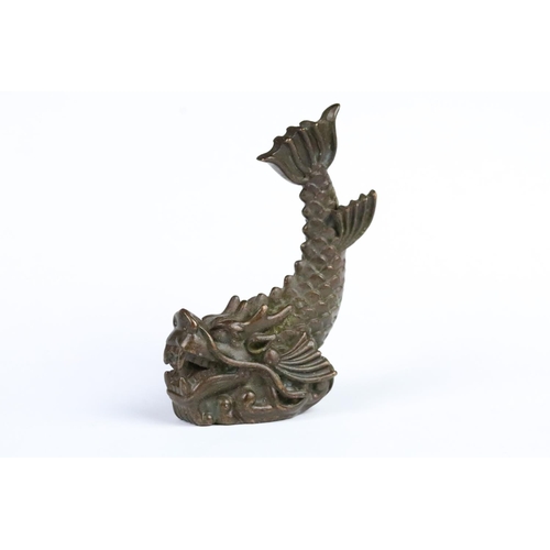 259 - Cast bronze figurine in the form of a Chinese dragon fish. Measures 7cm tall.